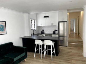 Centrally located modern 2-bedroom home & parking